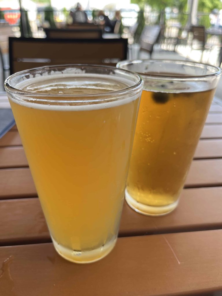 Two glasses of beer on a table