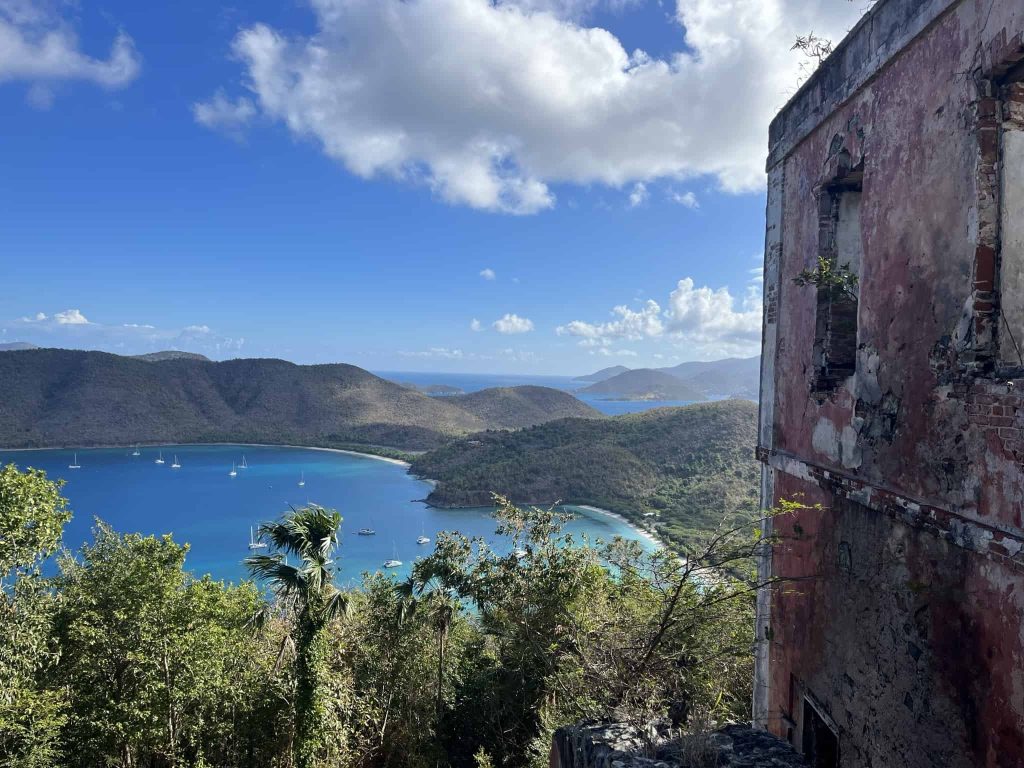 Ruins of sugar mill with beach in background