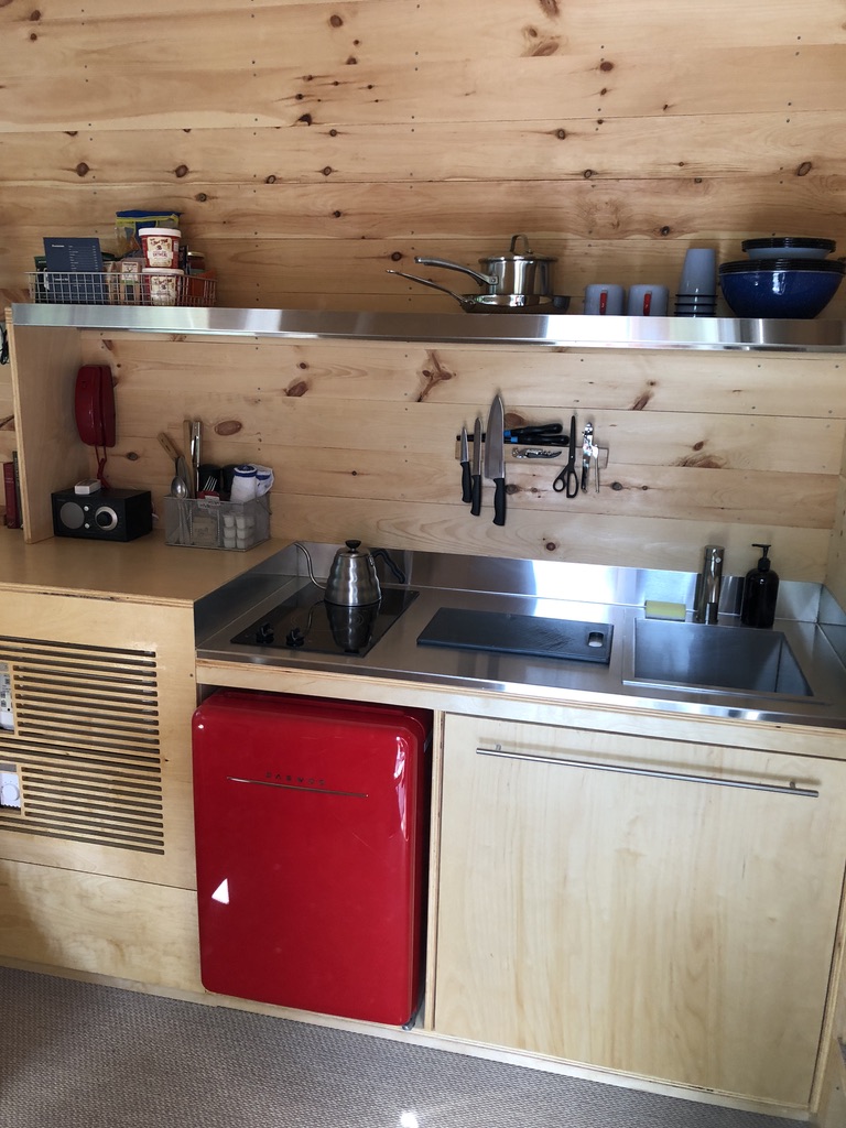 Interior view of the Getaway cabin showing bed and view