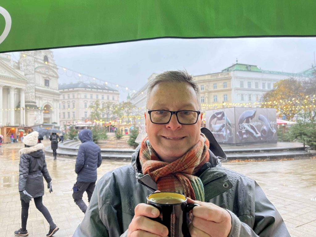 Drinking a hot apple punch at Vienna markets