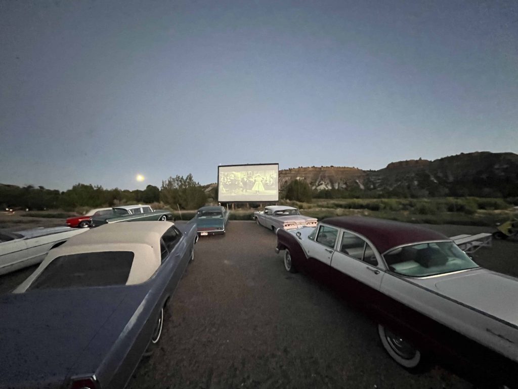 Drive Inn at Yonder with vintage cars and movie playing