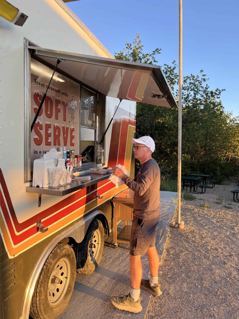 Food Truck with man picking up order at Yonder Escalante