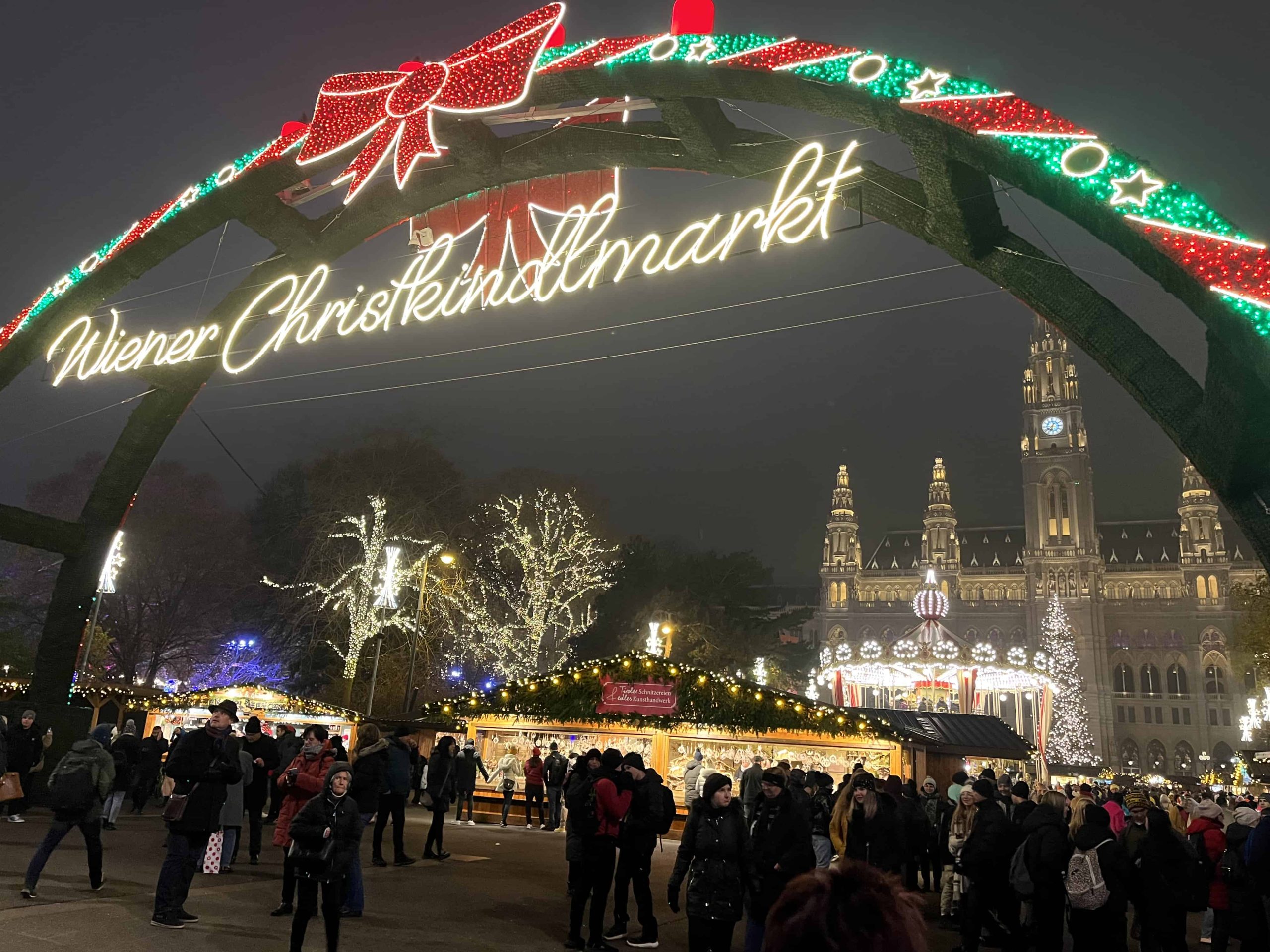The lights and decorations of the Vienna Rathaus Christmas Market at night