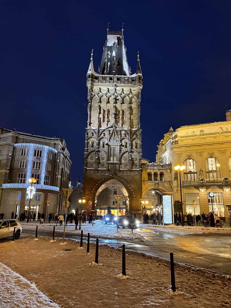 Powder Tower in Prague at night after a December snow storm