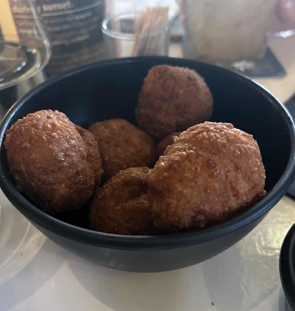 A bowl of delicious fried cheese balls.