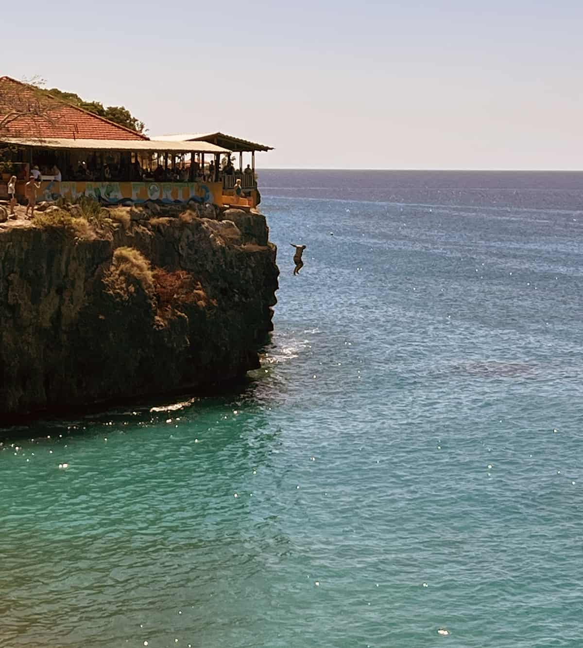 View from restaurant of cliff divers at Playa Forti in Curacao.