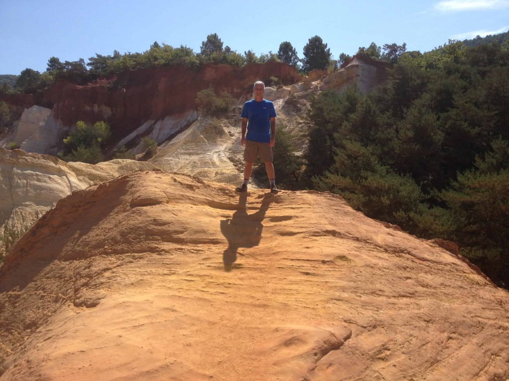 Mike hiking in Rousillon with the red rocks.