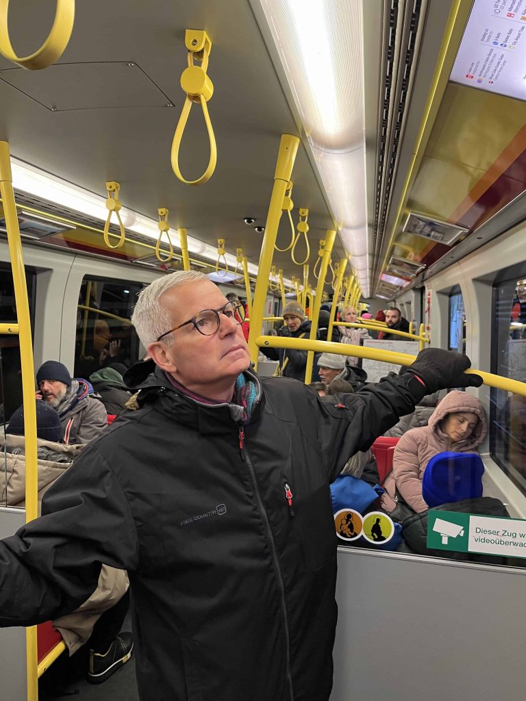 Mike riding the subway on our Christmas Market trip 2023. 